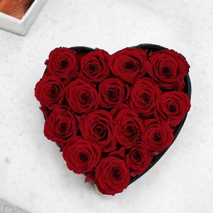 Surprise your loved one with this Noosa Collection preserved roses heart box. The perfect gift, this everlasting floral bouquet features 16 beautiful mini red roses arranged in a heart-shaped box